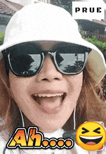 a woman wearing sunglasses and a white hat with the word prue in the corner