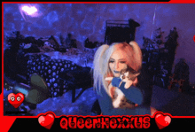 a woman is holding a cat in her arms and the words queenfoxxus are above her