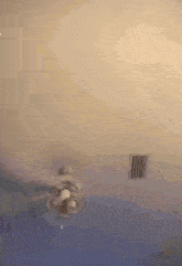 a ceiling fan is spinning on a ceiling in a room