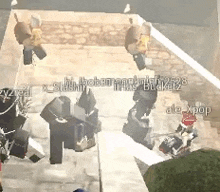 a group of people are playing a video game on a brick sidewalk .