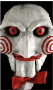 a picture of a puppet with red eyes and a bow tie
