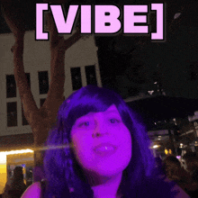 a woman in a purple wig is smiling with the words [ vibe ] above her