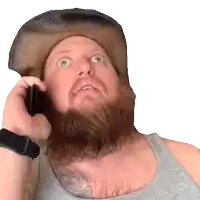 a man with a beard wearing a cowboy hat talks on a cell phone