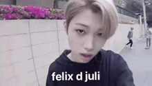 a close up of a person 's face with the words felix d juli on it .