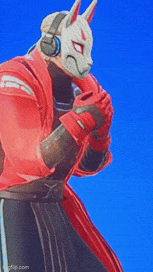 a man wearing a rabbit mask and headphones is standing in front of a blue sky