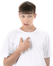 a young man in a white t-shirt points to his chest