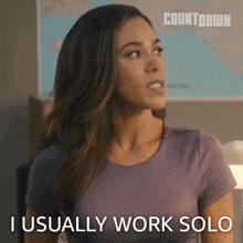 a woman says i usually work solo in a purple shirt