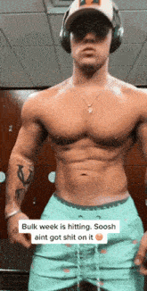 a shirtless man wearing headphones and a hat says bulk week is hitting soosh ain t got shit on it