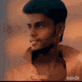 a close up of a man 's face with the word chiru on the bottom