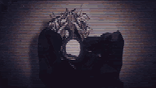 a silhouette of a person with dreadlocks behind a striped background