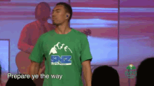 a man in a green shirt that says snz youth on it