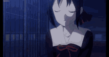 a girl with her eyes closed is standing in front of a fence