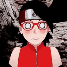 a girl with glasses and a headband is wearing a red jacket and a headband .