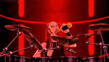 a cartoon of a man drinking while playing drums