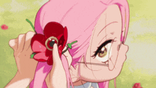 a girl with purple eyes is eating something with a spoon in her mouth