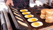 eggs are being cooked in a pan that says made in animotica on the bottom