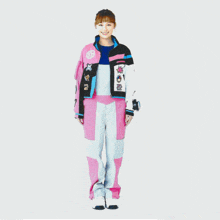 a woman is wearing a pink and black outfit with a sticker on the back that says ' spro '