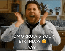 a man in a tie is screaming with his hands in the air .