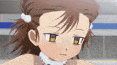 a close up of a girl 's face with a slight smirk on her face