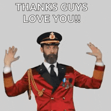 a man with a beard is wearing a red suit and hat and says `` thanks guys love you '' .
