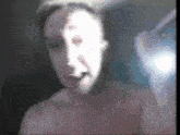 a blurred image of a woman with a white face