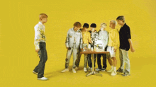 a group of people standing around a table with a green explosion behind them