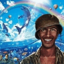 a man is smiling in front of a picture of dolphins and a rainbow .