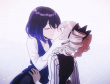 a couple of anime girls kissing each other .