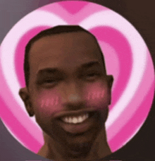 a man is smiling in front of a pink heart shaped background
