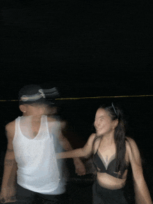 a blurry photo of a man and woman holding hands in the dark