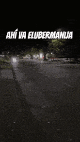 a black and white photo of a street with the words ahi va elubermanja