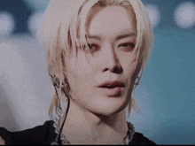 a close up of a man with blonde hair