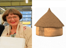 a woman is smiling next to a picture of a thatched hut