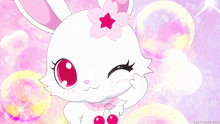 a white rabbit with a pink flower on its head and a cherry on its chest