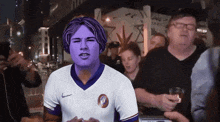 a man with purple hair and a white nike shirt