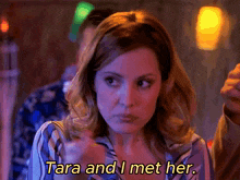 a woman says tara and i met her in yellow letters