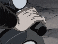 a close up of a person 's hand on a motorcycle handlebar