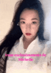a close up of a woman 's face with the name michelle on the bottom right