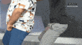 a man and a child are dancing in front of a sign that says quickie