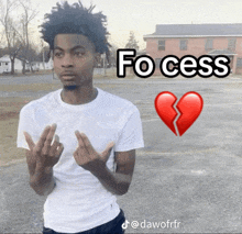 a man in a white shirt is giving the middle finger in front of a picture of a broken heart and the words fo cess