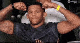 a man flexes his muscles in front of a screen that says tnt sports
