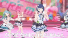 a group of anime girls are dancing on a stage in a video game with the words `` cutie smile harukaa '' .