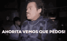 a man in a bullet proof vest says ahora vemos que pedos !