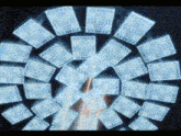 a circular pattern of squares with a few circles in the middle