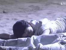 a person laying on a bed with the word te on the bottom