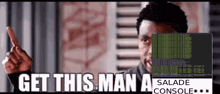 a man is pointing at a computer screen that says get this man a salade console