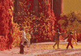 a group of people are walking down a street with confetti falling