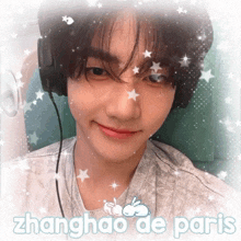 a picture of a young man with headphones and the words zhanghao de paris