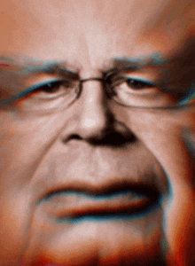 a close up of an older man 's face with glasses