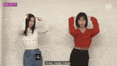 two girls are standing next to each other and one of them says scalp happy happy in a foreign language